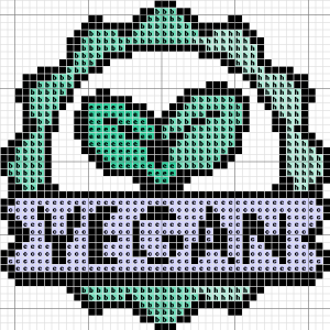 Cross stitch pattern featuring a leafy design with the word 'Vegan' in the center, in teal, purple, and black.