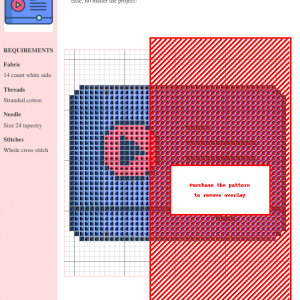 Image shows a cross-stitch pattern featuring a geometric design in shades of blue, pink, and white on a 14-count white aida fabric.