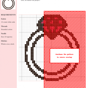 Cross-stitch pattern depicting a stylized ring design featuring black and red threads on white aida cloth.