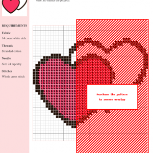 Cross-stitch pattern featuring a romantic design of two intertwined hearts in shades of pink and red on a white aida cloth.