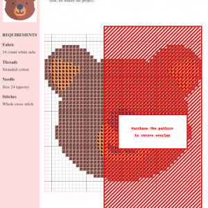 Cross stitch pattern of a cute bear, showcasing brown and orange threads on white aida cloth. The image includes a grid and material requirements.