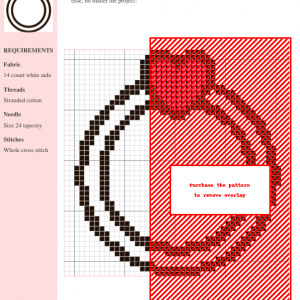 Cross stitch pattern of a ring with a small heart, featuring red and black threads on white aida fabric.