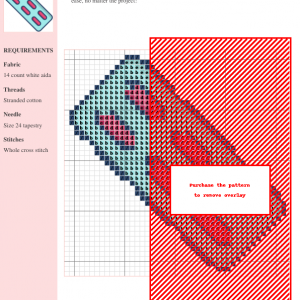 Image shows a cross-stitch pattern design featuring a geometric, capsule-like shape in shades of pink, teal, and dark blue on a white aida cloth background.