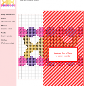 Cross-stitch pattern featuring a colorful ring design with pink, purple, orange, and yellow floral motifs on 14-count white Aida fabric.