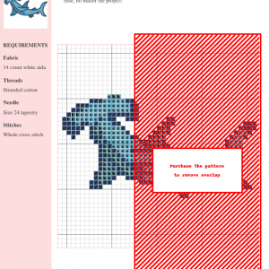 Cross stitch pattern featuring a detailed hammerhead shark design in shades of blue and gray, suitable for crafting enthusiasts.