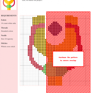 Cross stitch pattern chart featuring a stylized catapult design in warm colors like red, orange, and yellow, on a white aida cloth background.