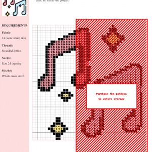 Cross stitch pattern depicting musical notes in shades of red, pink, and black on white aida cloth.