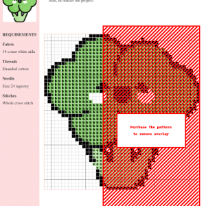 Cross stitch pattern of a charming broccoli floret, featuring green and brown stitches on white aida cloth. A watermark overlay obscures part of the design.