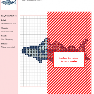 Cross-stitch pattern of a pollock fish, featuring a detailed design with varying shades of blue and gray on a white aida cloth.