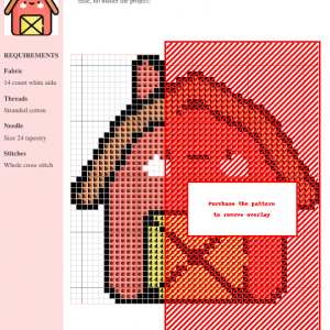Cross stitch pattern design of a charming barn in shades of red and orange. The image shows the complete pattern chart.