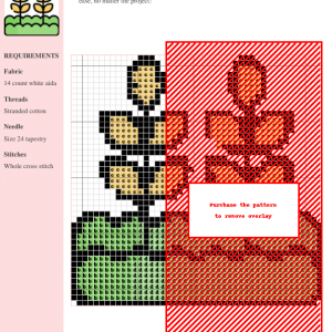 Cross stitch pattern depicting a wheat stalk in shades of gold, green, and red. The design is rustic and charming.