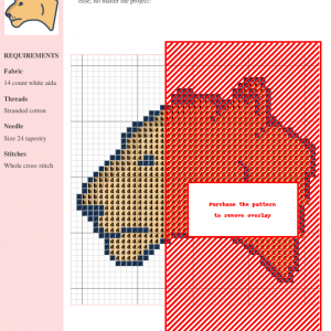 Cross stitch pattern of a majestic lioness head, featuring earthy tones and detailed stitching. The design uses whole cross stitch.