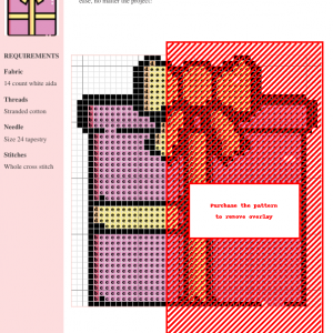 Image of a cross stitch pattern depicting a pink gift box tied with a yellow ribbon.