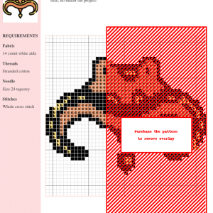 Image of a cross stitch pattern depicting a stylized orange creature with curved horns and yellow accents.