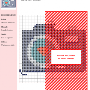Cross stitch pattern depicting a stylized camera with a heart in the lens, featuring a teal, red, and gray color palette.