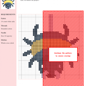 Image of a cross-stitch pattern featuring a cute, cartoonish spider hanging on its web. The spider is predominantly dark gray with a yellow stripe.