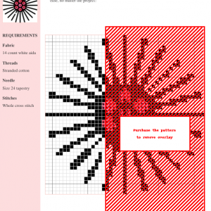 Cross stitch pattern depicting a stylized flower with radiating petals and a central cluster of smaller circles in shades of pink and red.