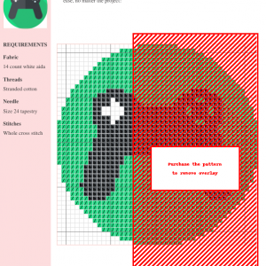 Cross stitch pattern depicting a video game controller, featuring black and white details on a green background.