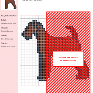 Cross stitch pattern of a brown Airedale Terrier, standing profile, outlined in dark blue.