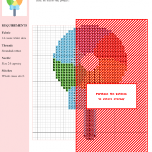 Cross stitch pattern of a colorful lollipop with a light blue bow, perfect for needlepoint enthusiasts.