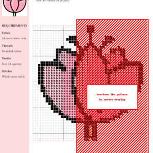 Image of a cross stitch pattern depicting a delicate pink lotus flower with a simple green stem.