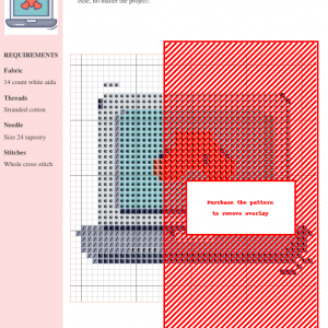 Image of a cross stitch pattern design featuring three red hearts displayed on a laptop screen.