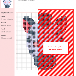 Image of a charming zebra cross stitch pattern featuring a simplified zebra head design in black, white, and pink.