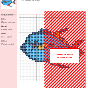Cross stitch pattern of a stylized moon fish, featuring blue, orange, and yellow threads.