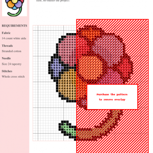 Image of a colorful flower cross stitch pattern. The flower has seven rounded petals in various shades of red, orange, yellow, blue, and purple, with a yellow center. A simple green stem is included.