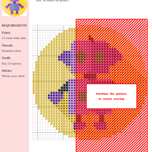 A charming cross-stitch pattern featuring a purple robot with green eyes, perfect for crafting projects.