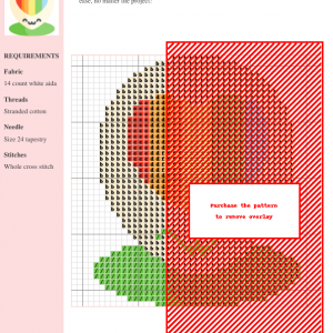 Cross stitch pattern featuring a cute flower with a rainbow heart in its center. The design is predominantly pastel colors with a vibrant rainbow.