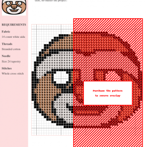 Close-up of a charming sloth cross stitch pattern design, featuring a simplified, cartoonish sloth face in warm brown and cream colors.