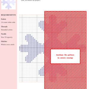 Image of a cross stitch pattern depicting a delicate snowflake in shades of white and light blue.
