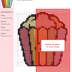 A charming cross-stitch pattern depicting a bucket of rainbow-colored popcorn with a smiling face.