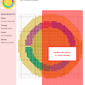 Image of a cross stitch pattern depicting a colorful hula hoop design with sections of pink, purple, green, and blue surrounding a yellow center.