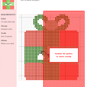 Cross stitch pattern of a cute gift box with a green ribbon and rosy cheeks.