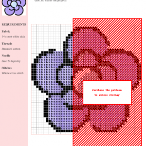 Image of a clematis cross stitch pattern featuring a stylized lavender flower with a light blue center. The design is simple yet elegant.