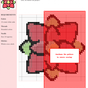Image of a poinsettia cross stitch pattern featuring red petals, a yellow center, and green leaves. A simple yet charming floral design.