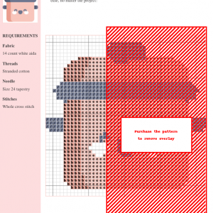 Cross stitch pattern depicting a cute, cartoonish cooking pot with a smiling face, in soft pink and gray colors.
