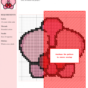 Close-up of a cross stitch pattern depicting a pink orchid with red center. The design is simple yet elegant.