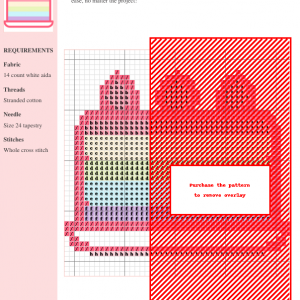 Cross stitch pattern of a pastel rainbow layered cake with three strawberry toppers.