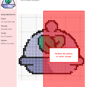 Image of a cross stitch pattern depicting a cloche dish with two green leaves, symbolizing vegan food.