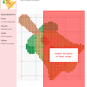Image of a bell cross stitch pattern featuring a yellow bell with a brown cross, accented by green leaves and a brown handle.