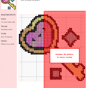 Cross stitch pattern depicting a kawaii-style heart-shaped key with sparkling accents.