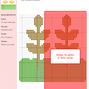 Image of a cross stitch pattern depicting two stalks of wheat in a field of green.